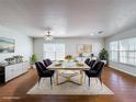 Elegant dining room featuring a modern table set, stylish chairs, and a cozy rug at 1176 Liberty Hall Dr, Kissimmee, FL 34746
