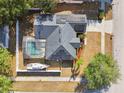 Aerial view of a home with solar panels, screened pool and a boat in the backyard at 149 Southern Breeze Dr, Minneola, FL 34715