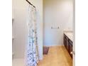 Bathroom featuring shower with curtain and a dark vanity with sink at 156 Eagleview Loop, Davenport, FL 33837