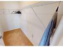 Walk-in closet provides ample storage with wire shelving and carpeted floor at 156 Eagleview Loop, Davenport, FL 33837