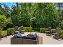 Relaxing outdoor patio area with comfortable seating and lush greenery at 1563 Song Sparrow Ct, Sanford, FL 32773