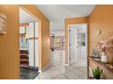 Bright, airy home with tile floors, open floor plan, and a view of the laundry room and living room at 1631 Long Ridge Ct # 268, Orlando, FL 32807