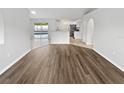 Spacious living room with attractive floors, light colored walls, and abundant natural light at 1730 Lochshyre Loop, Ocoee, FL 34761