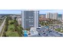 Beautiful high-rise condo building showcasing a pool, ample parking, and golf course views at 2 Oceans West Blvd # 2006, Daytona Beach Shores, FL 32118