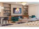 Stylish living room with a fireplace, modern shelving, and elegant decor for entertaining at 2123 Lelani Cir, Davenport, FL 33897