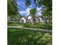 Gorgeous single Gathering home with a lush lawn, stone accents, and a tile roof at 25519 Hawks Run Ln, Sorrento, FL 32776
