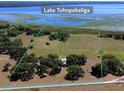Aerial shot of a large, open parcel of land near Lake Tohopekaliga, marked by green borders at 3650 Lake Tohopekaliga Rd, St Cloud, FL 34772