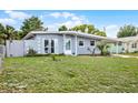 Charming single-story home with a covered carport, tidy lawn and fresh landscaping at 4908 Keith Pl, Orlando, FL 32808