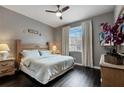 Relaxing bedroom with a ceiling fan, plush bed, and a light-filled window at 505 Terrace Ridge Cir # 505, Davenport, FL 33896