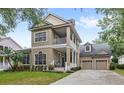 Beautiful home with a spacious porch and a two-car garage at 6037 Caymus Loop, Windermere, FL 34786