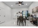 Bright dining area with marble floors, recessed lighting, and stylish decor at 675 S Cedar Ave, Orange City, FL 32763