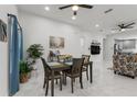 Open-concept living area features neutral walls, marble floors, and comfortable seating at 675 S Cedar Ave, Orange City, FL 32763
