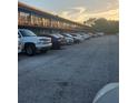 Ample parking spaces with a view of the building's exterior at 7900 S Orange Blossom Trl # 2025, Orlando, FL 32809