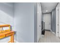 Bright hallway featuring neutral walls, tile flooring, and white doors, creating a clean and inviting atmosphere at 129 S Park Ave # 129, Winter Garden, FL 34787