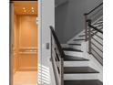 Elegant staircase adjacent to an elevator showcases dark wood steps and modern railings in a naturally lit space at 129 S Park Ave # 129, Winter Garden, FL 34787