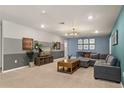 Cozy bonus room featuring plush carpet, a comfortable sectional sofa, and stylish decor at 2036 Lelani Cir, Davenport, FL 33897
