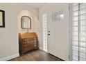 Inviting foyer with glass-block sidelights and wood-look tile floors at 2532 Waterview Pl, Windermere, FL 34786