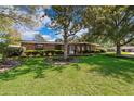 Inviting single-story brick home with a well-manicured lawn and established landscaping at 2609 Chinook Trl, Maitland, FL 32751