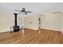 Spacious living room with hardwood floors and a cozy fireplace at 320 Granada Dr, Winter Park, FL 32789