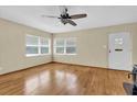 Bright living room featuring hardwood floors and several windows for natural light at 320 Granada Dr, Winter Park, FL 32789