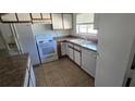 The kitchen offers essential appliances, and tile flooring for practicality and ease of maintenance at 4906 Gifford Blvd, Orlando, FL 32821
