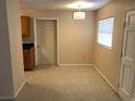 Cozy dining area featuring neutral walls, modern light fixture, and an access door at 530 Ruffel St, Maitland, FL 32751