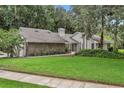 Landscaped front yard with a stone accent wall adding character to this attractive single-Gathering home at 700 Bear Shadow Ct, Longwood, FL 32779