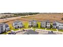 An aerial view of modern two-story homes with well-manicured lawns in a newly developed neighborhood at 9084 Sommerset Hills Dr, Davenport, FL 33896