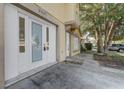 Close-up view of the front entrance featuring ornate glass doors and a well-lit, covered entryway at 9447 Dearmont Ave, Orlando, FL 32825