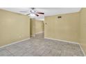 Open-concept living area with tile flooring flowing seamlessly into adjacent rooms at 1001 Dora Ave, Tavares, FL 32778