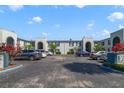 Scenic exterior view of condos with ample parking and lush landscaping at 1048 Plantation Dr # 12, Kissimmee, FL 34741