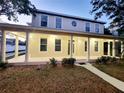 Charming two-story home with large front porch, updated lighting, and well-maintained landscaping at 14521 Tanja King Blvd, Orlando, FL 32828