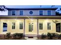 Two-story home with classic architectural details including columns and a round window detail on the second story at 14521 Tanja King Blvd, Orlando, FL 32828