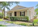 Well-kept home with a cozy front porch, attractive landscaping, and classic architectural details at 14738 Porter Rd, Winter Garden, FL 34787