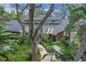 Aerial view of the home showing lush landscaping and a well-maintained exterior at 204 Green Lake Cir, Longwood, FL 32779
