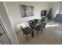 Stylish dining area featuring a modern glass table and comfortable seating at 2252 Tay Wes Dr, St Cloud, FL 34771