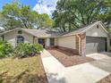 Attractive single-story home with a well-kept lawn and inviting entryway at 2647 Lake Landing Blvd, Eustis, FL 32726