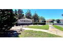 The Veradas community entrance is marked by a handsome monument surrounded by trees, bushes, and iron fencing at 2865 Running Brook Cir, Kissimmee, FL 34744