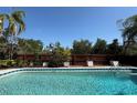 Inviting backyard swimming pool, perfect for relaxing and entertaining, with lush landscaping and privacy fence at 361 Tulip Trl, Casselberry, FL 32707