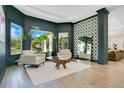Stylish living room with designer furniture, large windows, and elegant hardwood flooring at 4210 Waterfront Pkwy, Orlando, FL 32806