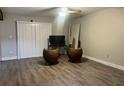 Open living room with modern ceiling fan and durable vinyl flooring at 4838 Pebble Beach Dr # A, Orlando, FL 32811
