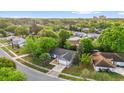 An aerial shot showcasing the home's location in a lush, green neighborhood with mature trees and well-kept yards at 4918 Gifford Blvd, Orlando, FL 32821