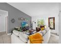 Cozy living room with comfortable seating, modern decor, and a view to the outside, promoting relaxation and comfort at 4918 Gifford Blvd, Orlando, FL 32821