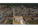 Aerial view of a single Gathering home showing surrounding neighborhood with other residential homes at 8509 Sw 136Th Loop, Ocala, FL 34473