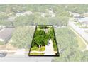 Aerial view of home showcasing lush landscaping, mature trees, and overall property layout at 1174 Snug Harbor Dr, Casselberry, FL 32707