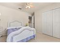 Bright bedroom with a large closet and a white wicker bed frame at 126 Knights Hollow Dr, Apopka, FL 32712