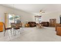 Bright living room and dining area with large windows and lots of open space at 126 Knights Hollow Dr, Apopka, FL 32712