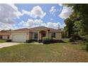 Charming single-story home with a two-car garage and well-maintained landscaping at 13157 Sw 35Th Cir, Ocala, FL 34473