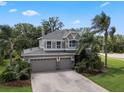 Beautiful two-story house featuring an attached three-car garage at 14315 Hampshire Bay Cir, Winter Garden, FL 34787
