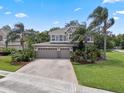 Charming two-story home with a three-car garage and a brick-paved driveway at 14315 Hampshire Bay Cir, Winter Garden, FL 34787